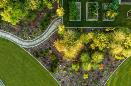 Aerial View of Modern Beautiful Backyard Garden with Three Vegetables Wooden Pots. Summer Time in a Garden.
